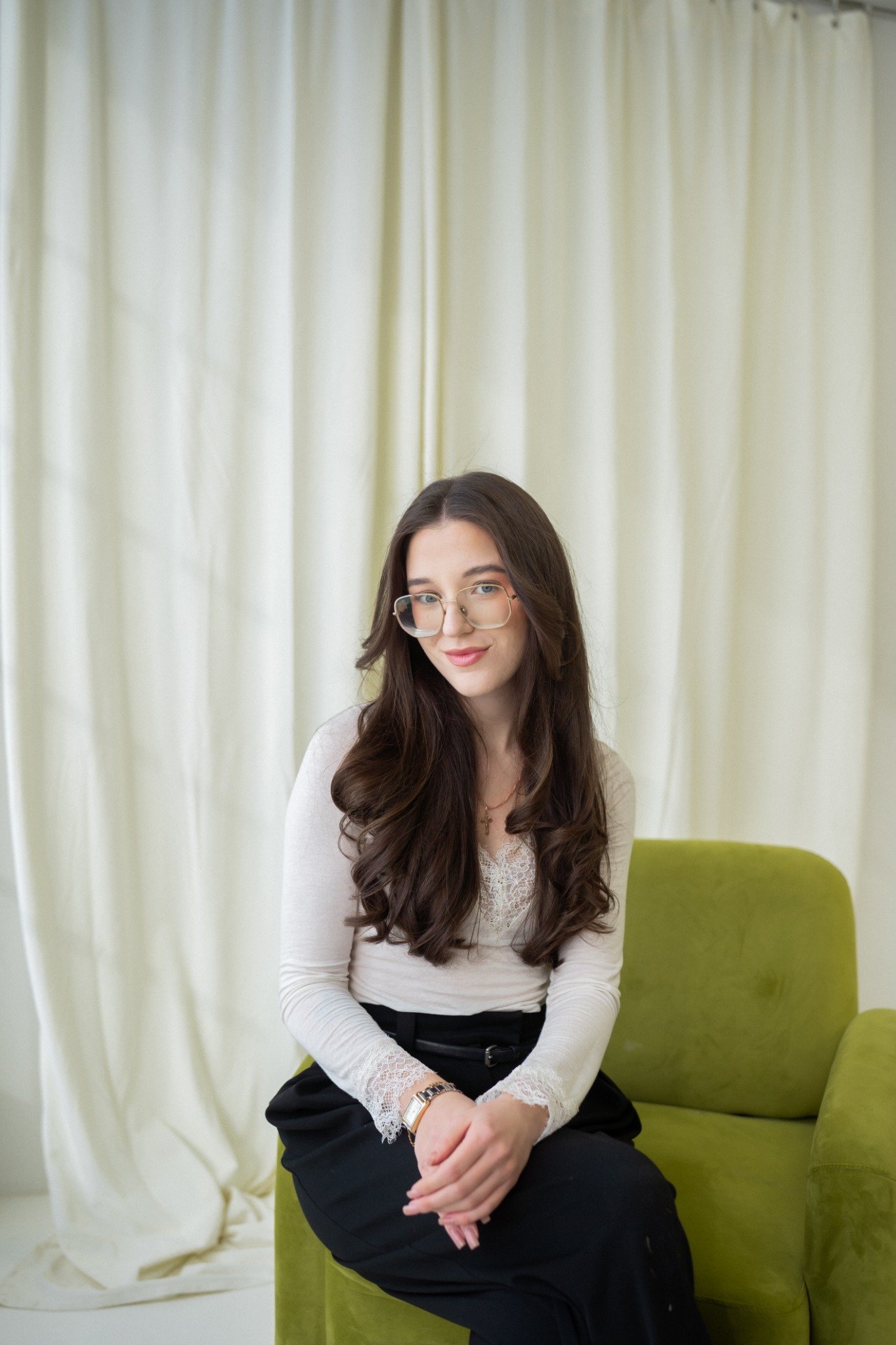Yaroslava Kuchma seated in a studio